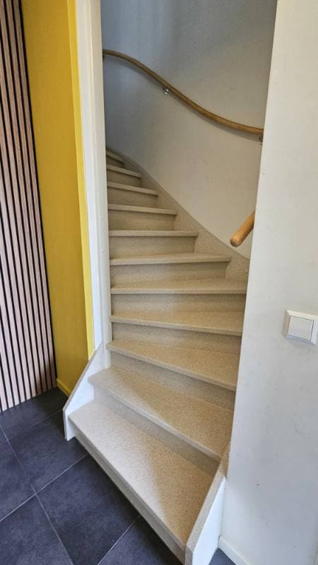 wooden staircase renovation with DesertBeige stone texture in Capelle aan den IJssel