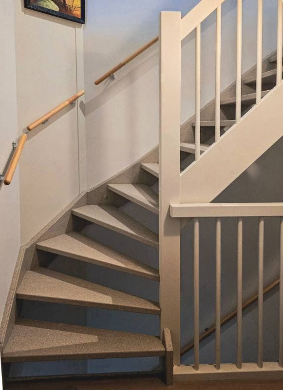 wooden staircase renovation with DesertBeige stone texture in Waddinxveen